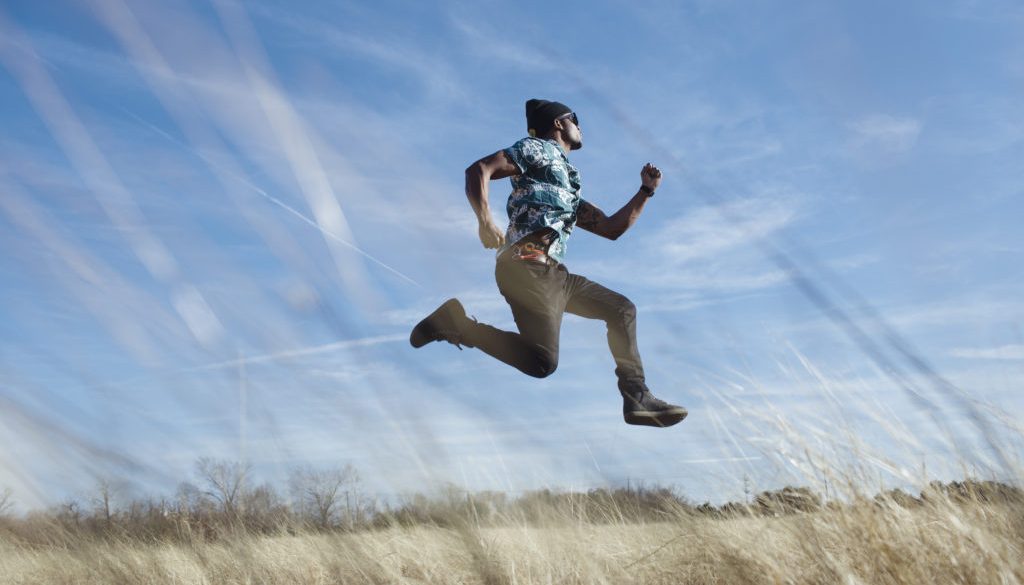 jumping in a field